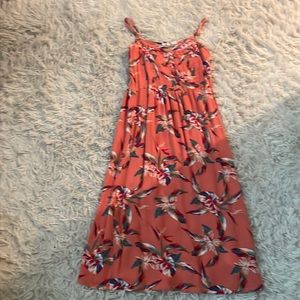 Size M for girls, orange/tan dress with Tania’s flowers on front and back.